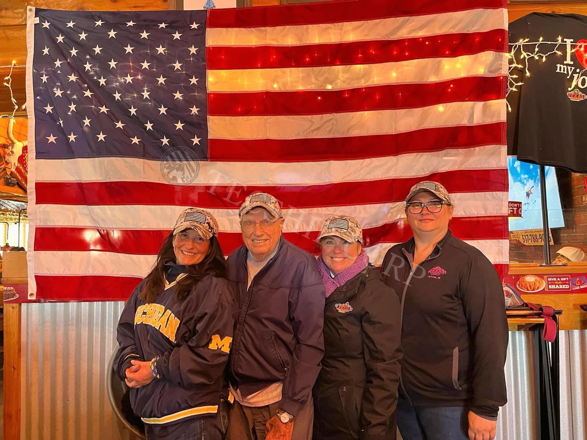 Veterans and supporters gathered before the United States flag
